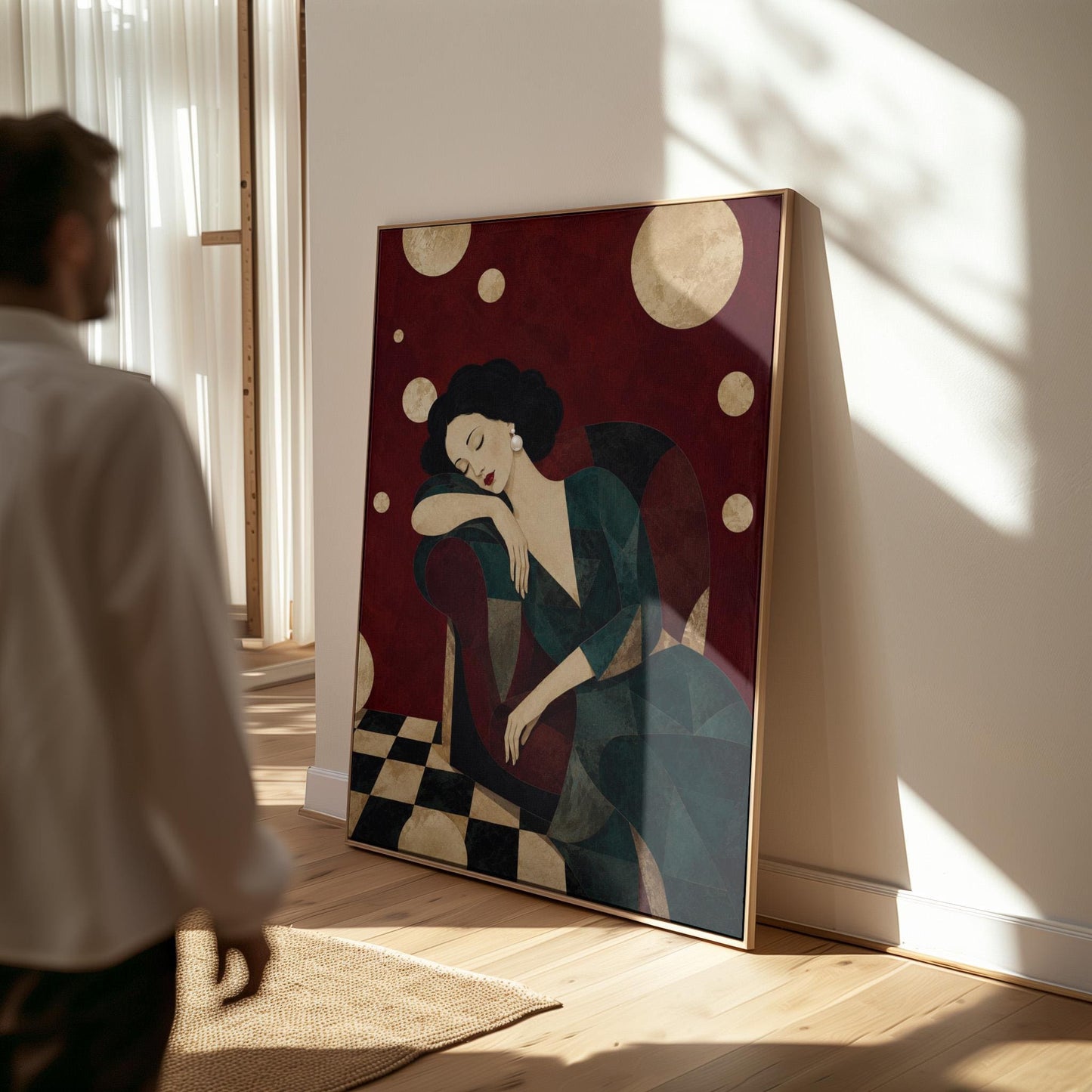Dark haired woman asleep draped over the back of a deep red armchair, canvas print displayed on a neutral wall in a styled interior