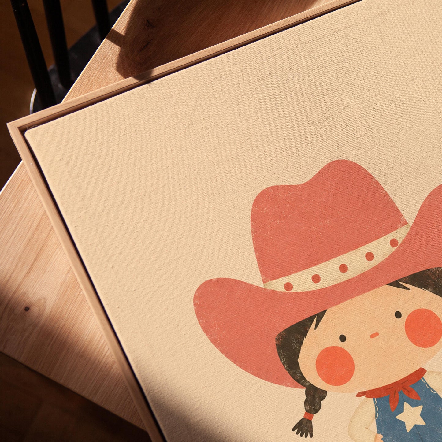 Small cowgirl in a star dress and coral hat with hands on hips, canvas print in a warm, minimally styled interior