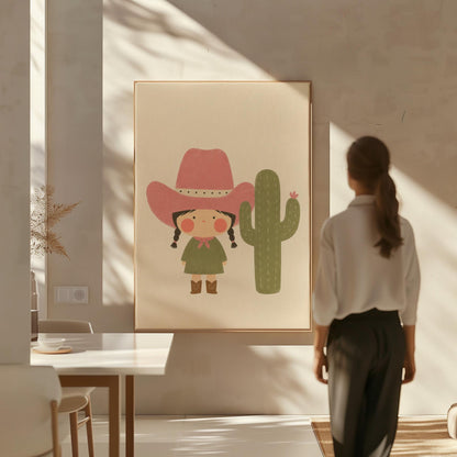 Little cowgirl in a pink hat next to a tall flowering cactus, canvas print presented in a light, minimal room