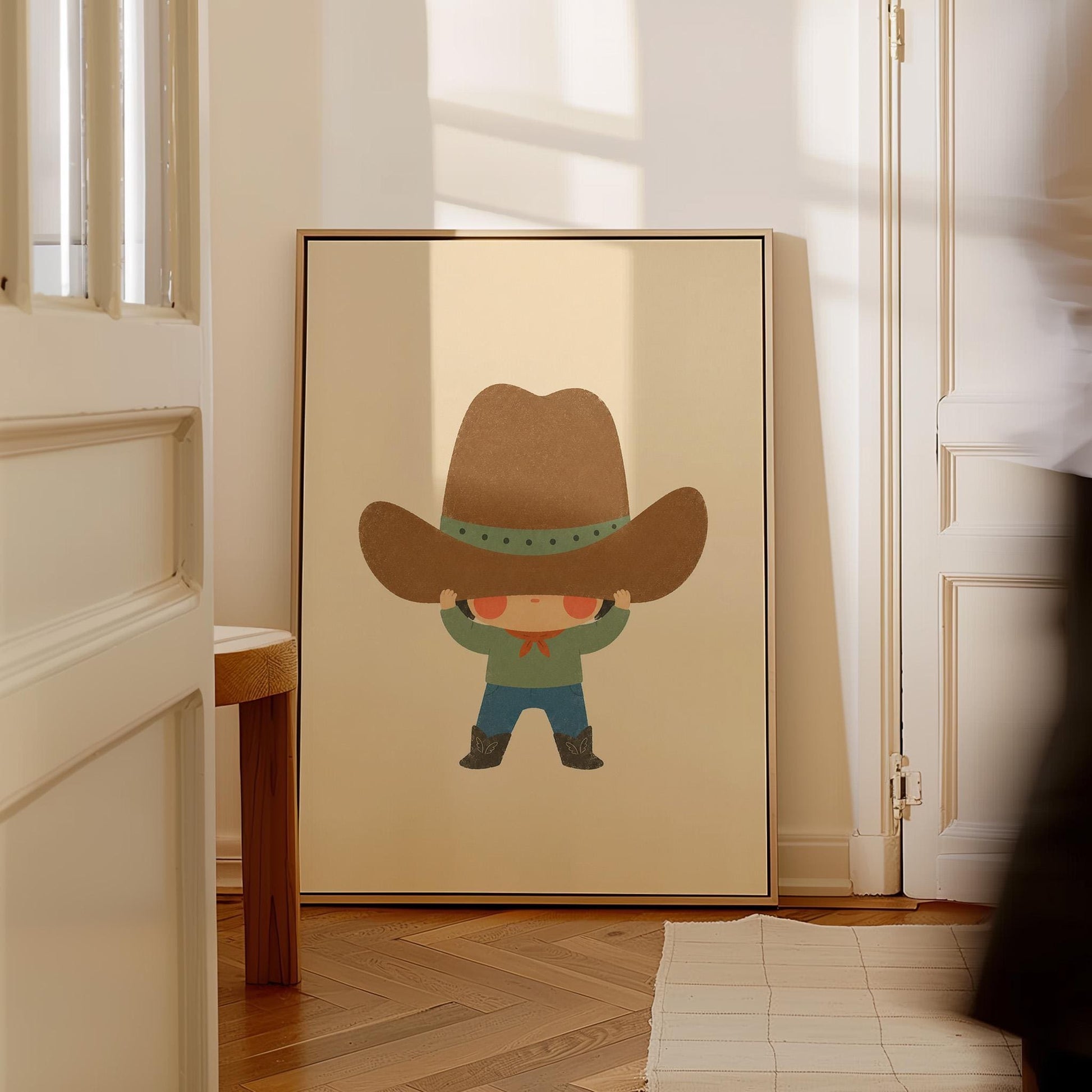 Child lifting an enormous brown cowboy hat above their eyes, canvas print styled against a soft white wall