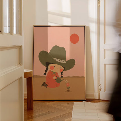 Cowgirl in a green hat watering a small flower in the desert, canvas print styled against a soft white wall