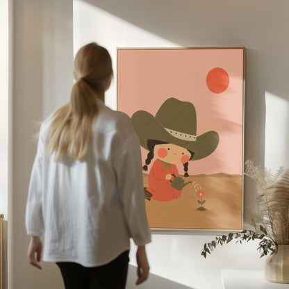 Cowgirl in a green hat watering a small flower in the desert, canvas print on a quiet wall in a considered interior