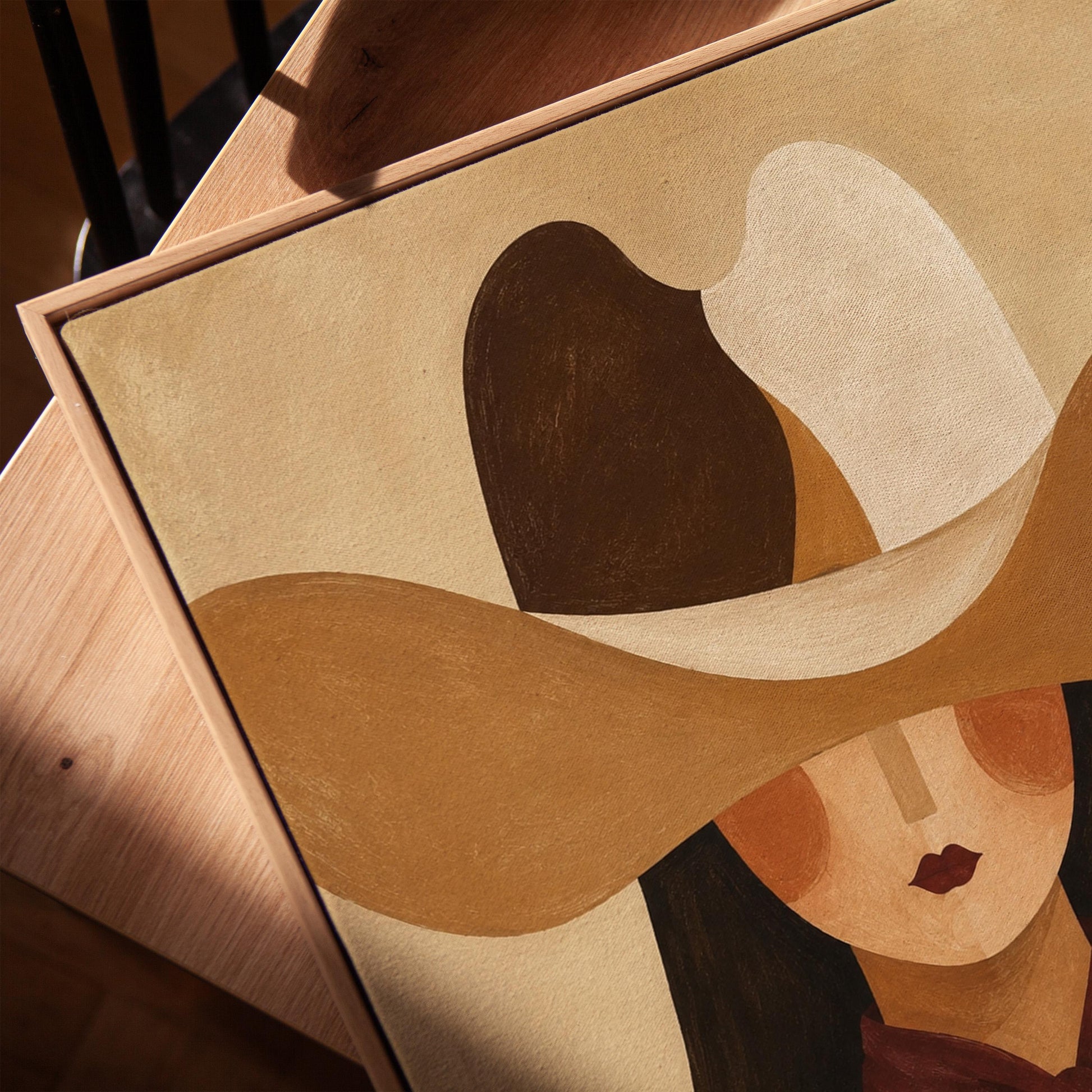 Cowgirl in a sweeping two-tone hat with a burgundy neckerchief, canvas print in a warm, minimally styled interior