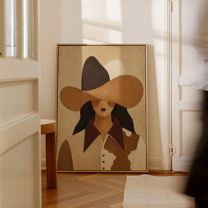 Cowgirl in a black and brown hat wearing a cow print shirt, canvas print shown to scale in a furnished room
