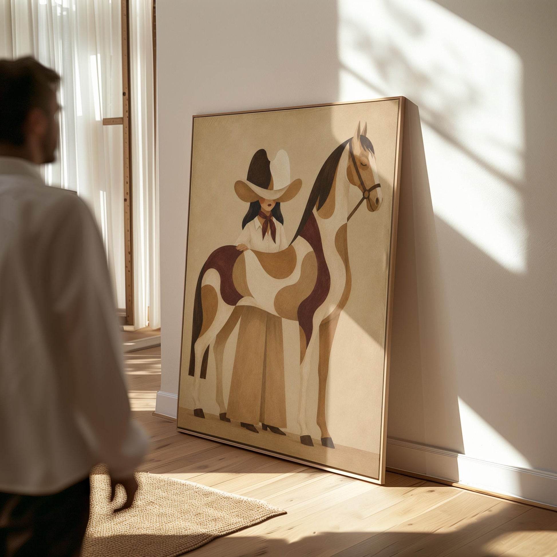 Cowgirl resting her hand on a paint horse with a deep burgundy blanket, canvas wall art presented in a light, minimal room
