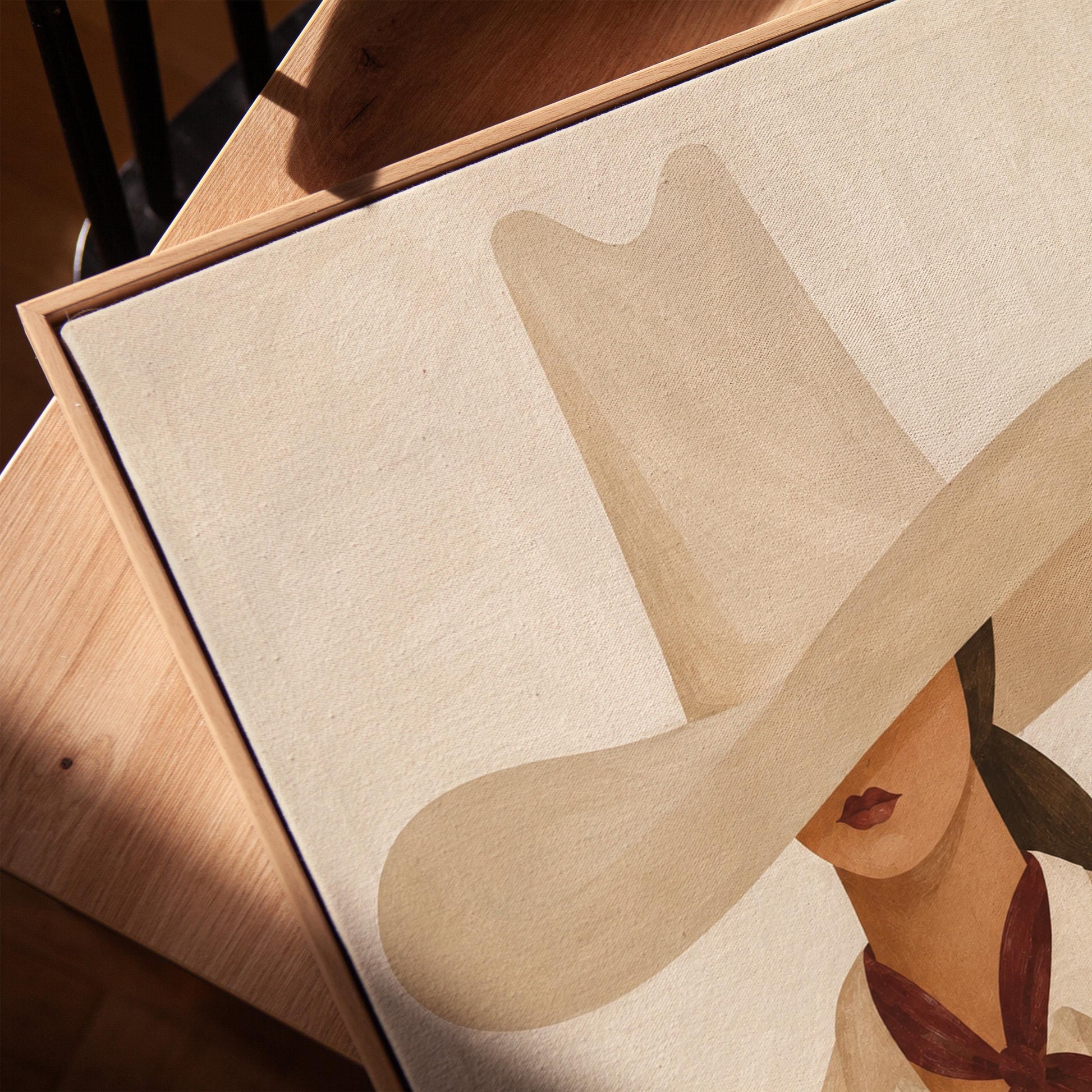 Cowgirl in a tall cream hat wearing a cowhide shawl and mauve scarf, canvas print in a warm, minimally styled interior