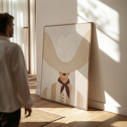Woman under an oversized pale cowboy hat with a plum neckerchief, canvas wall art styled against a soft white wall