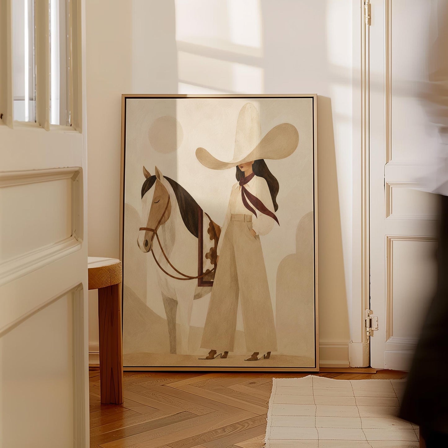 Cowgirl in cream trousers with a red scarf standing by a white horse, canvas print hanging in a calm, modern living space