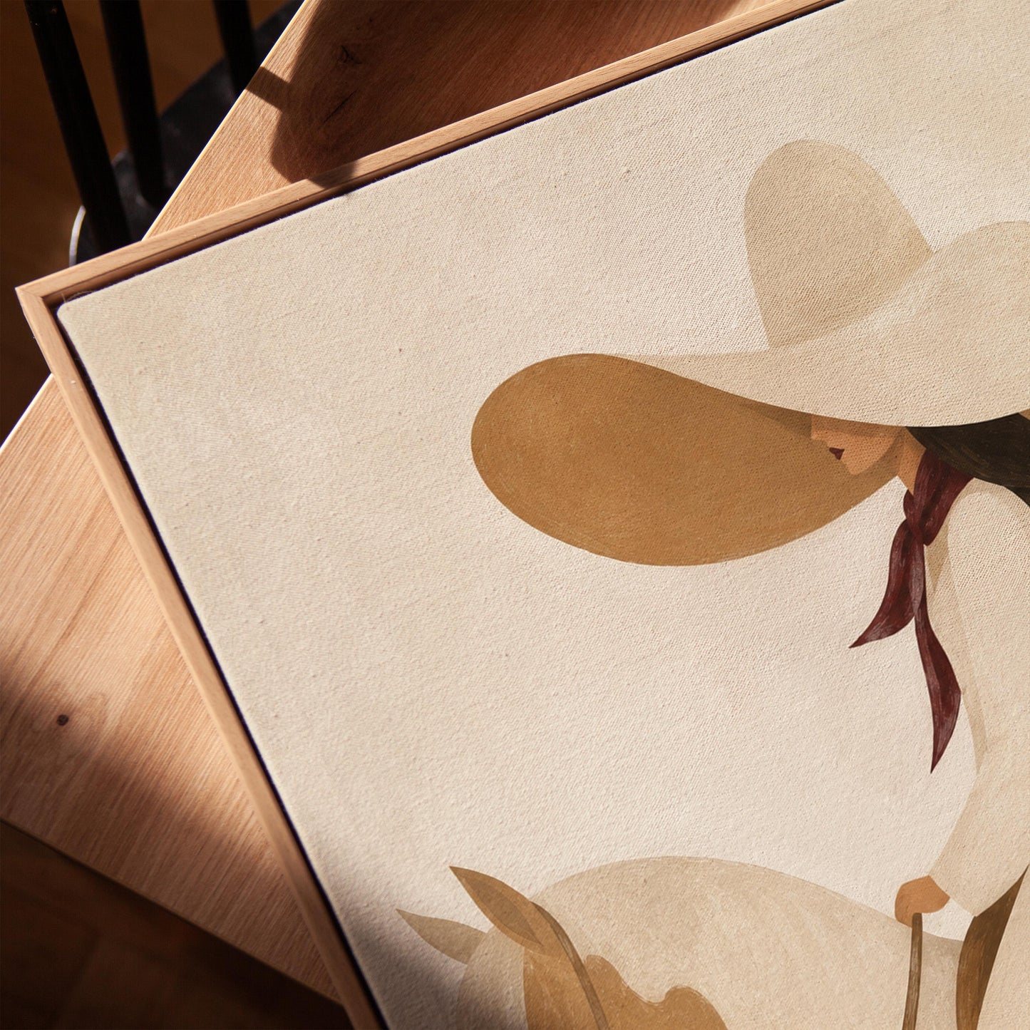 Woman in a long white dress and floppy hat riding a spotted horse, canvas print in a warm, minimally styled interior