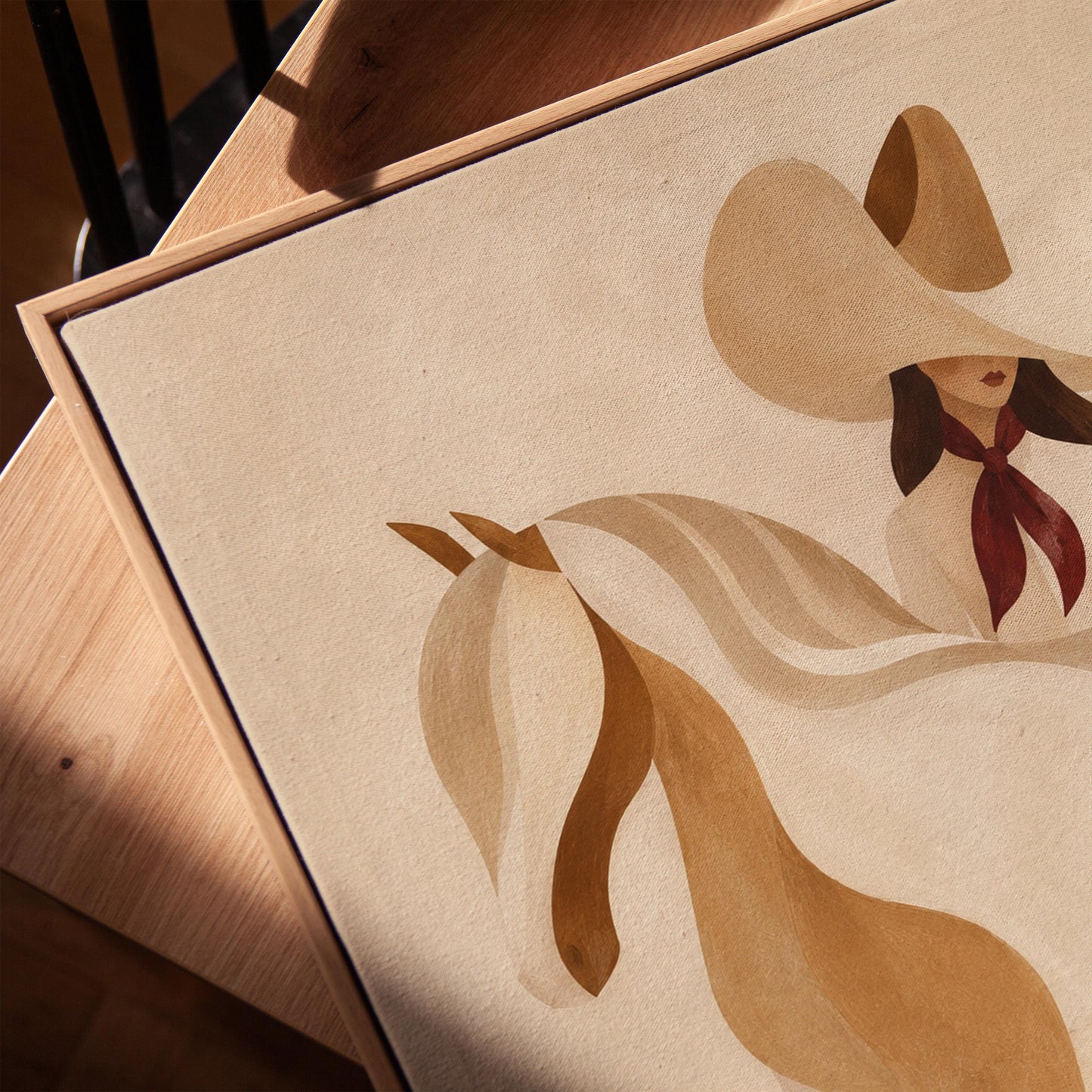Stylised cream horse in curved shapes with a rider in white above it, canvas print in a warm, minimally styled interior