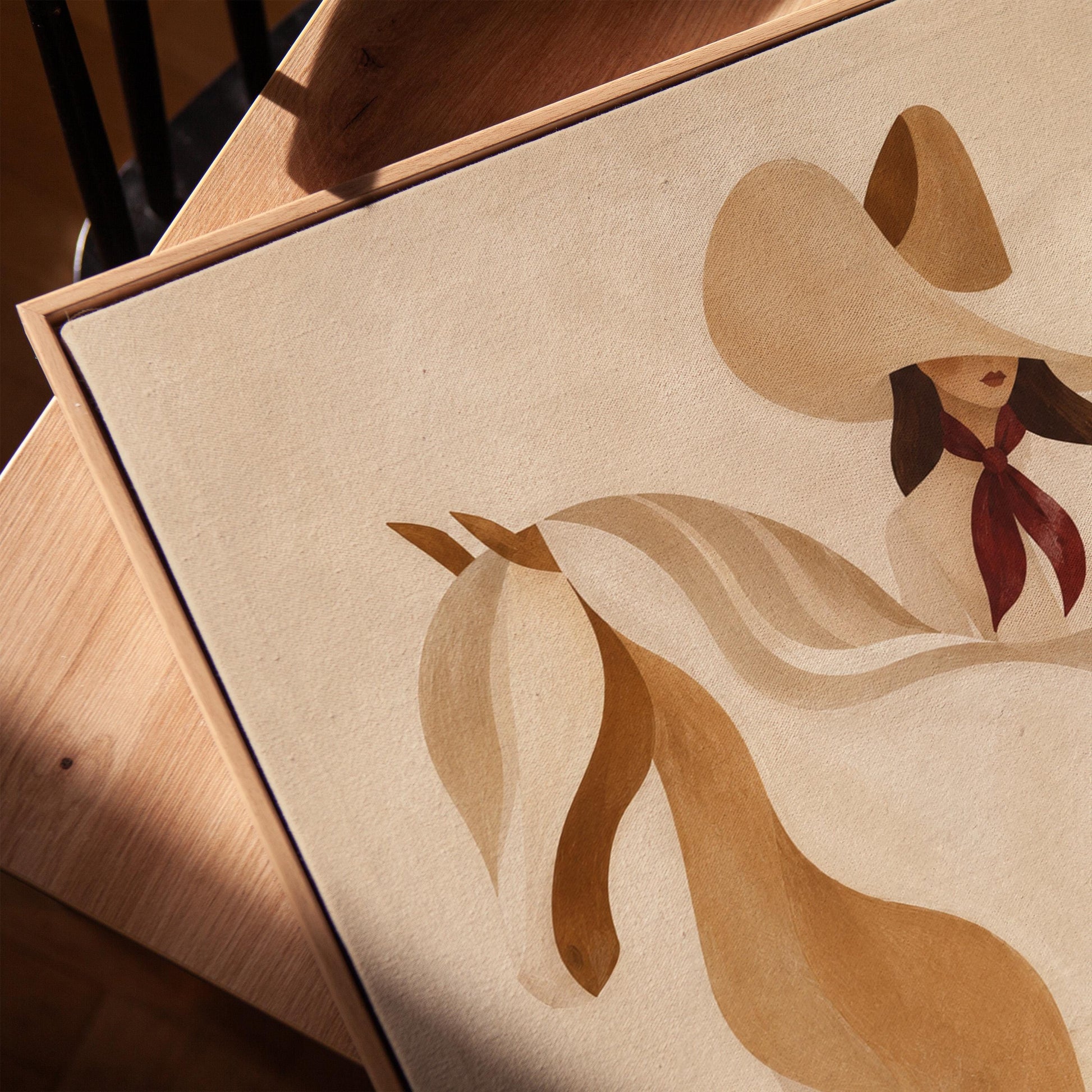 Stylised cream horse in curved shapes with a rider in white above it, canvas print in a warm, minimally styled interior
