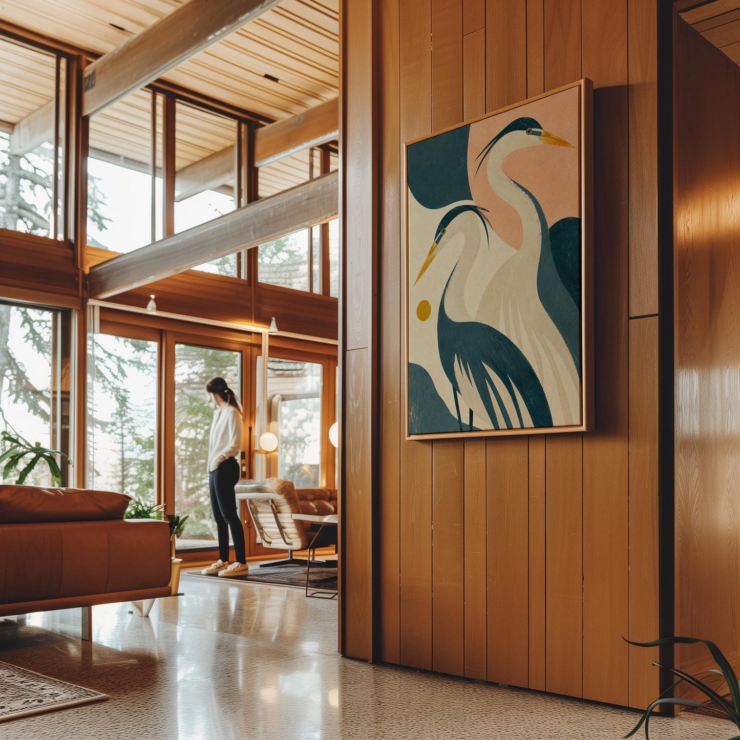 Two great herons with yellow beaks against a peach and teal sky, canvas wall art presented in a light, minimal room