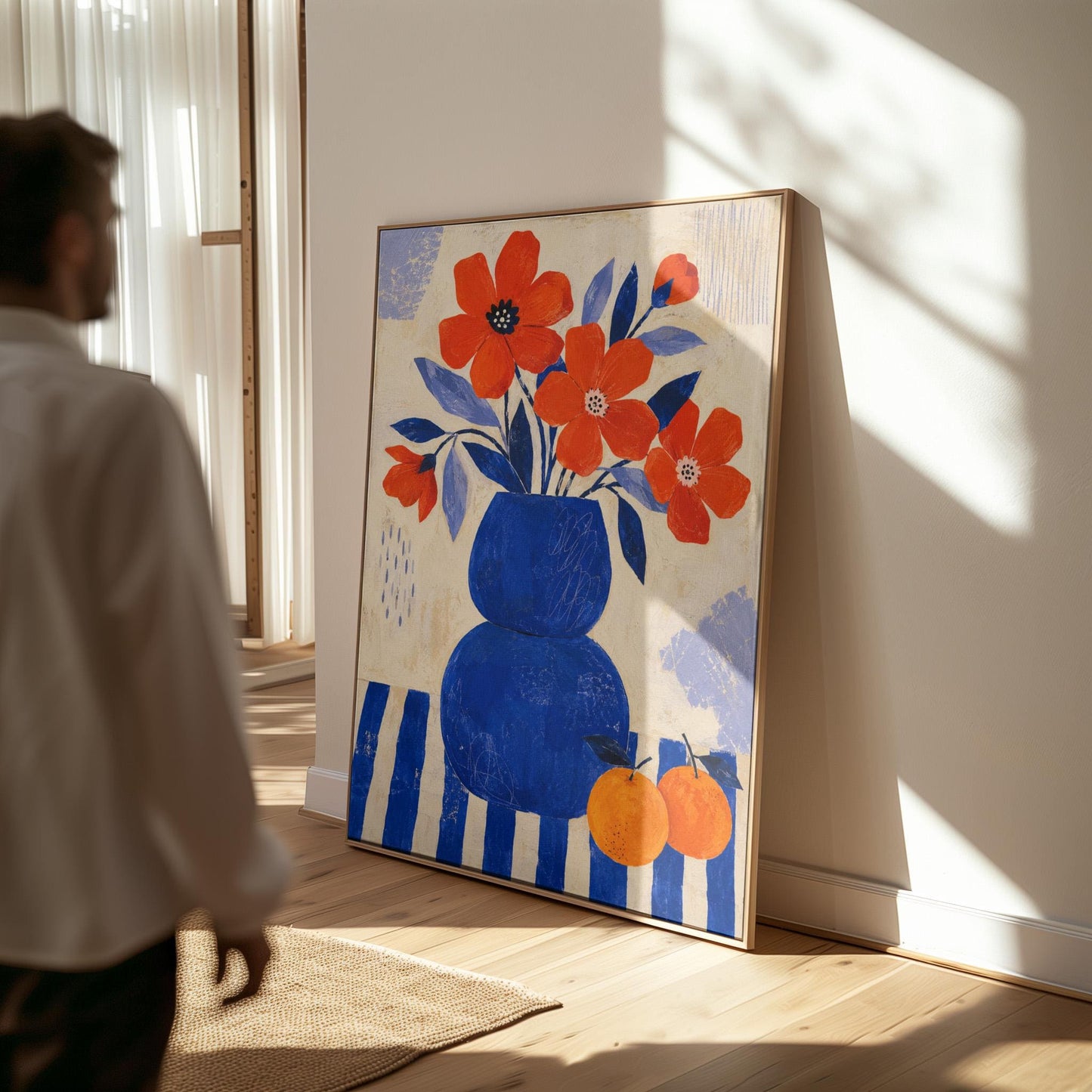 Scarlet poppies in a cobalt vase with oranges on a blue striped cloth, canvas print presented in a light, minimal room