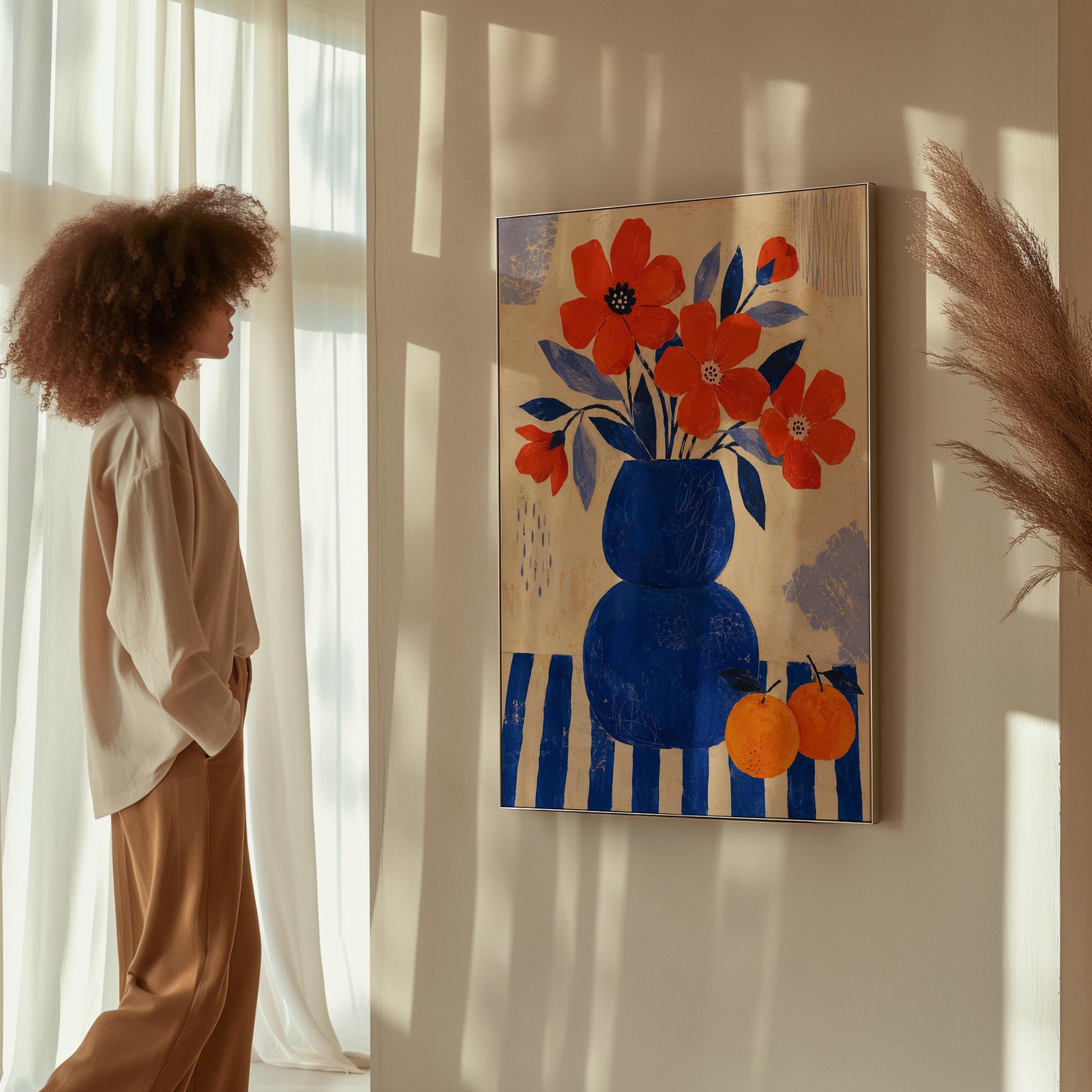 Scarlet poppies in a cobalt vase with oranges on a blue striped cloth, canvas wall art styled against a soft white wall