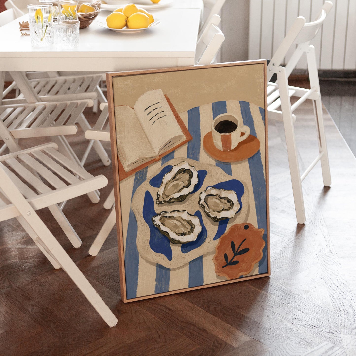 Plate of oysters with espresso and an open book on a striped cloth, canvas print seen in a warm interior with natural light