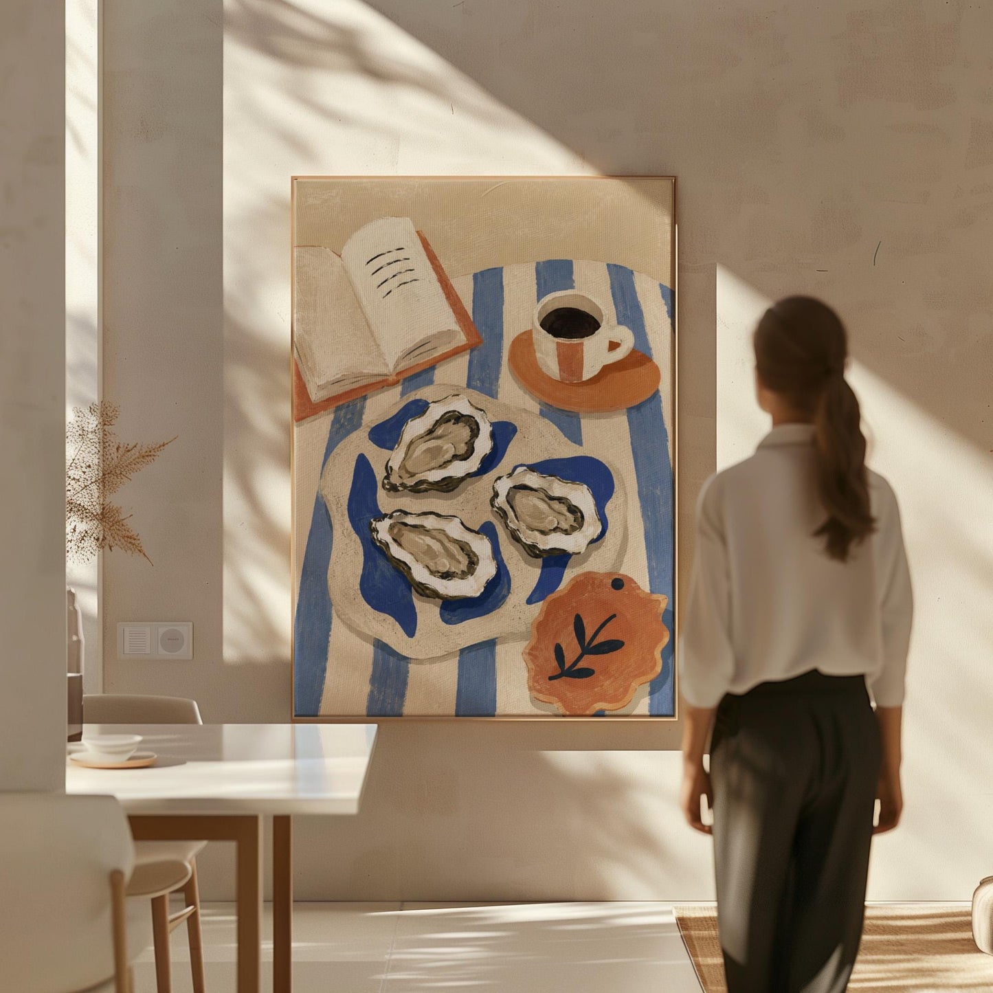 Plate of oysters with espresso and an open book on a striped cloth, canvas print presented in a light, minimal room