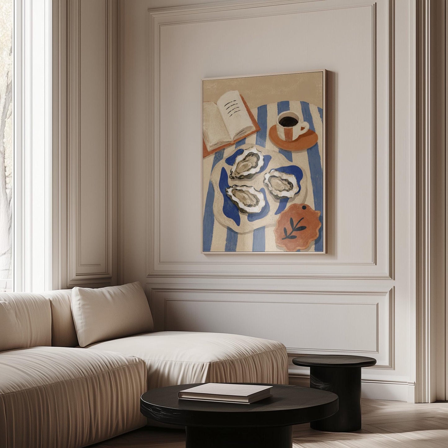 Plate of oysters with espresso and an open book on a striped cloth, canvas wall art hanging in a calm, modern living space