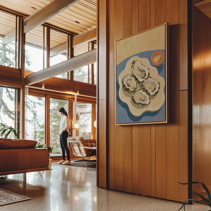 Four open oysters on a cream platter with lemon on a dusty blue ground, canvas print shown to scale in a furnished room