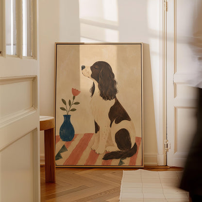 Brown and white spaniel sniffing a coral tulip in a small blue vase, canvas wall art styled against a soft white wall