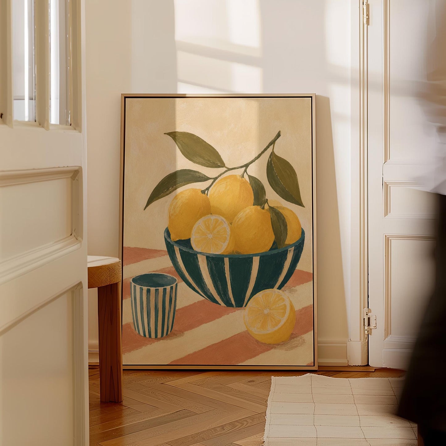 Lemons on the branch in a teal striped bowl on a pink striped cloth, canvas print hanging in a calm, modern living space