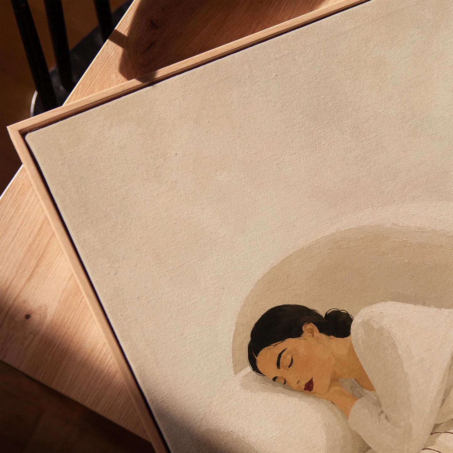 Woman sleeping under a white quilt threaded with fine burgundy lines, canvas print in a warm, minimally styled interior