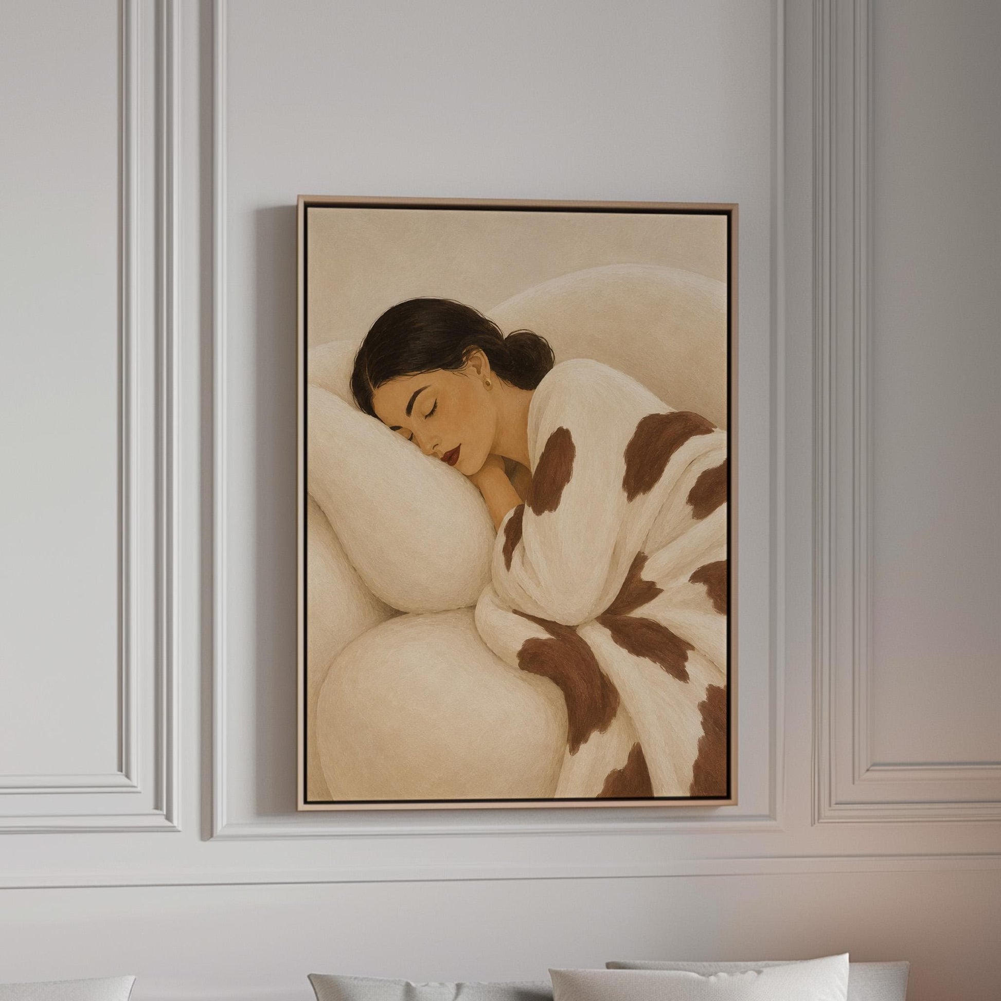 Woman asleep on a pillow under a cream blanket with brown markings, canvas print in a bright room with natural daylight