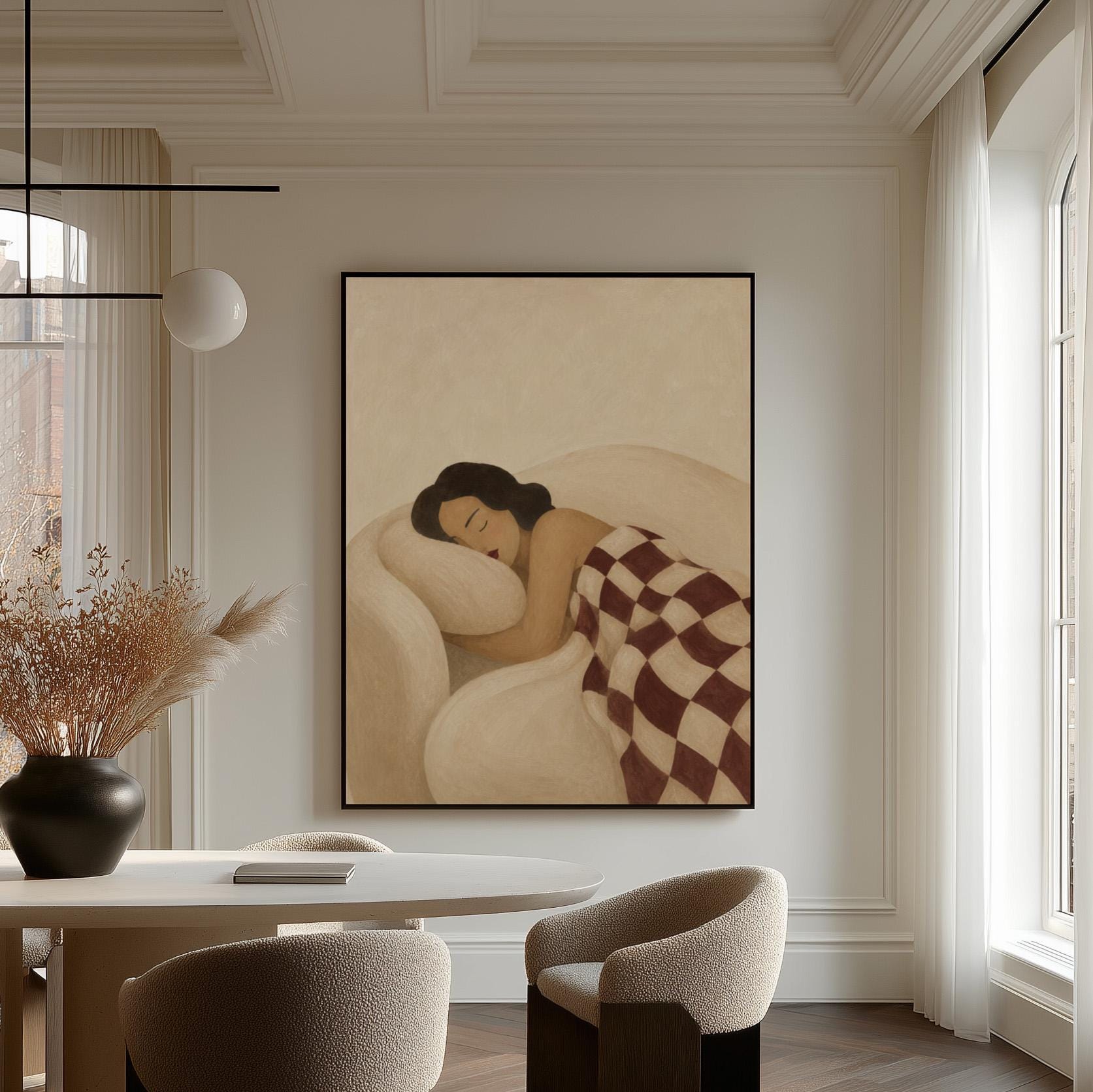 Woman sleeping under a burgundy and cream checkerboard blanket, canvas wall art hanging in a calm, modern living space