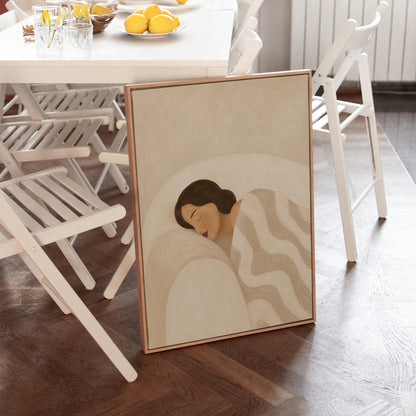 Woman asleep beneath a quilt of rolling cream and sand wave shapes, canvas wall art on a quiet wall in a considered interior