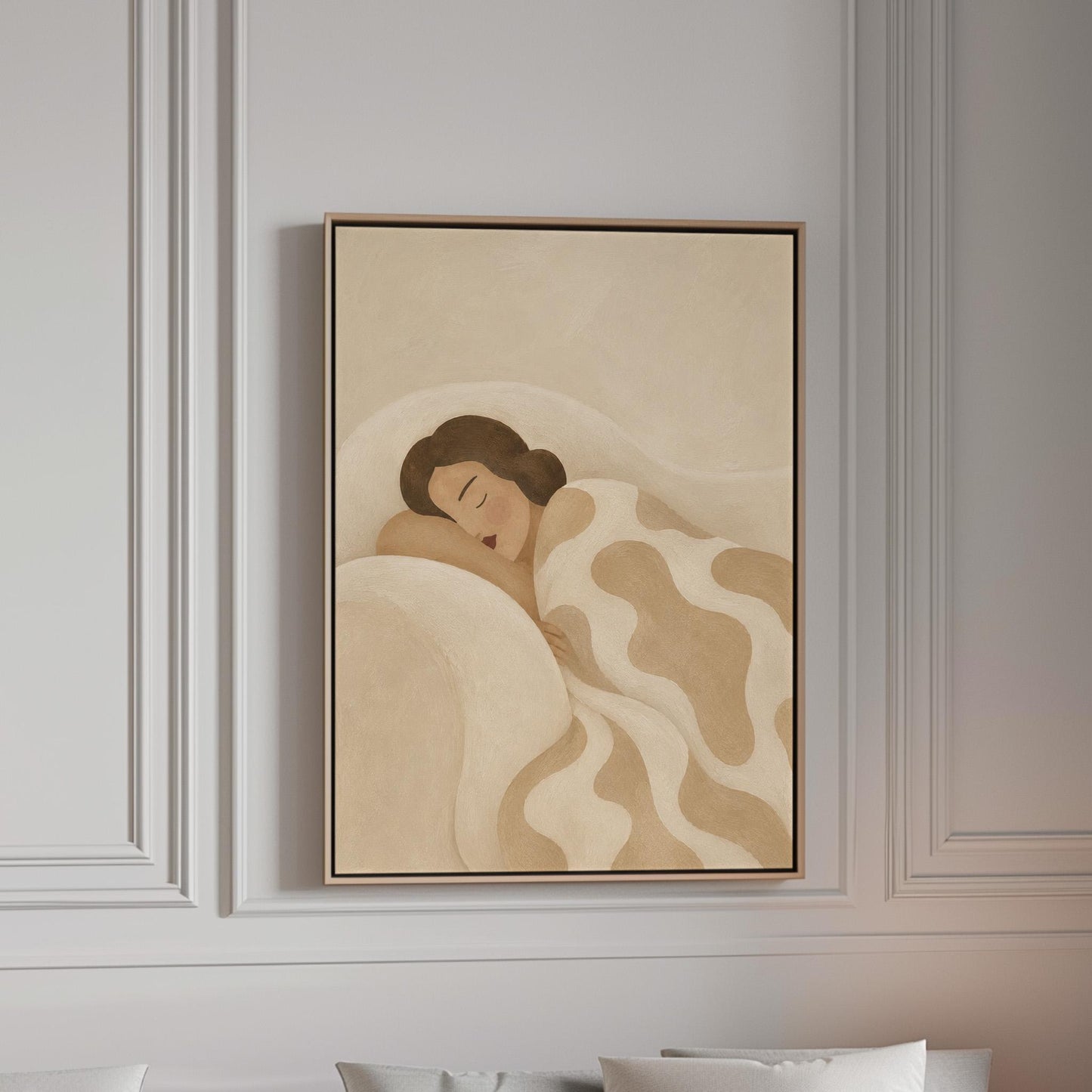 Woman sleeping under a cream blanket with soft camel cloud shapes, canvas print in a bright room with natural daylight