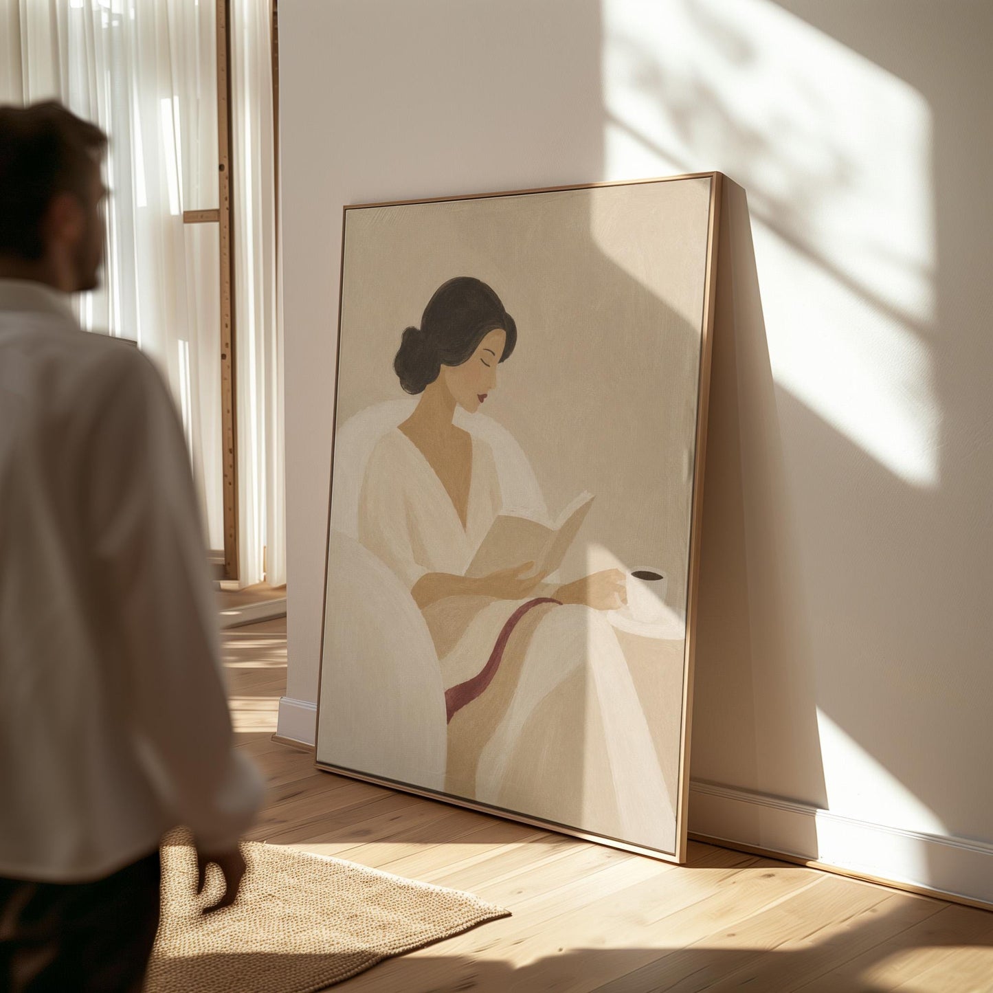 Woman in a white robe reading in an armchair with a black coffee, canvas wall art hanging in a calm, modern living space