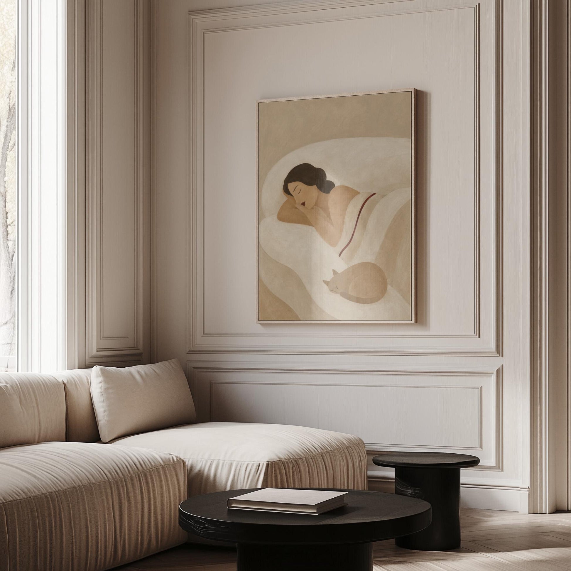 Woman sleeping with a small white cat curled at the foot of the bed, canvas print shown to scale in a furnished room
