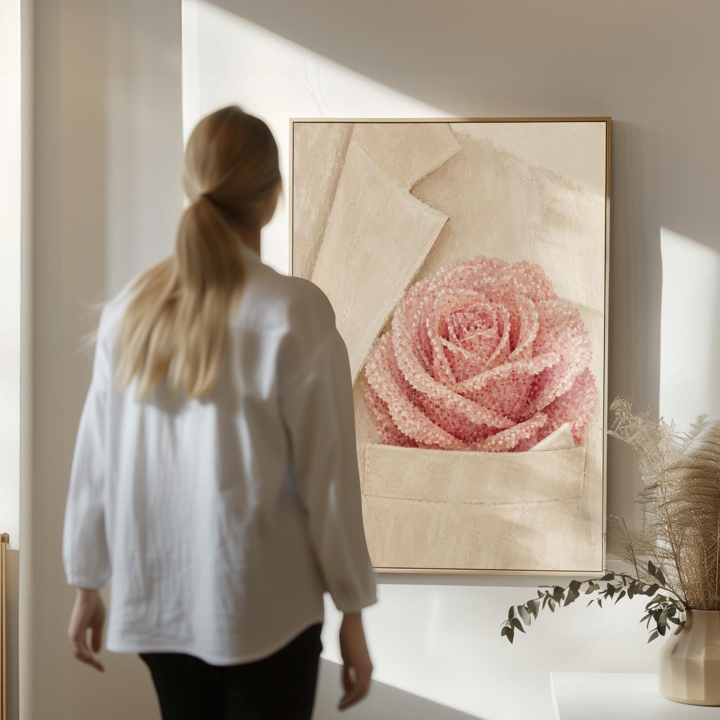 Blush pink rose with pearl beaded petals tucked into a cream pocket, canvas print shown in a sunlit, contemporary room