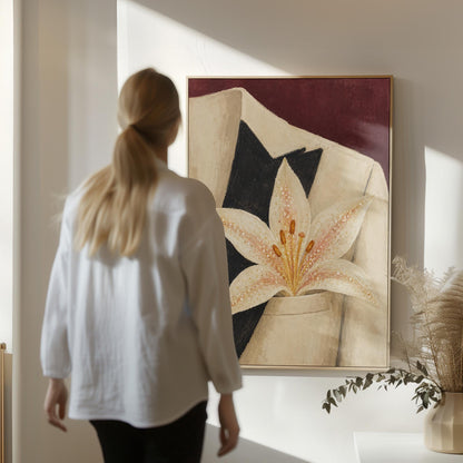 White pearl flecked lily on a cream tuxedo lapel over deep burgundy, canvas wall art presented in a light, minimal room