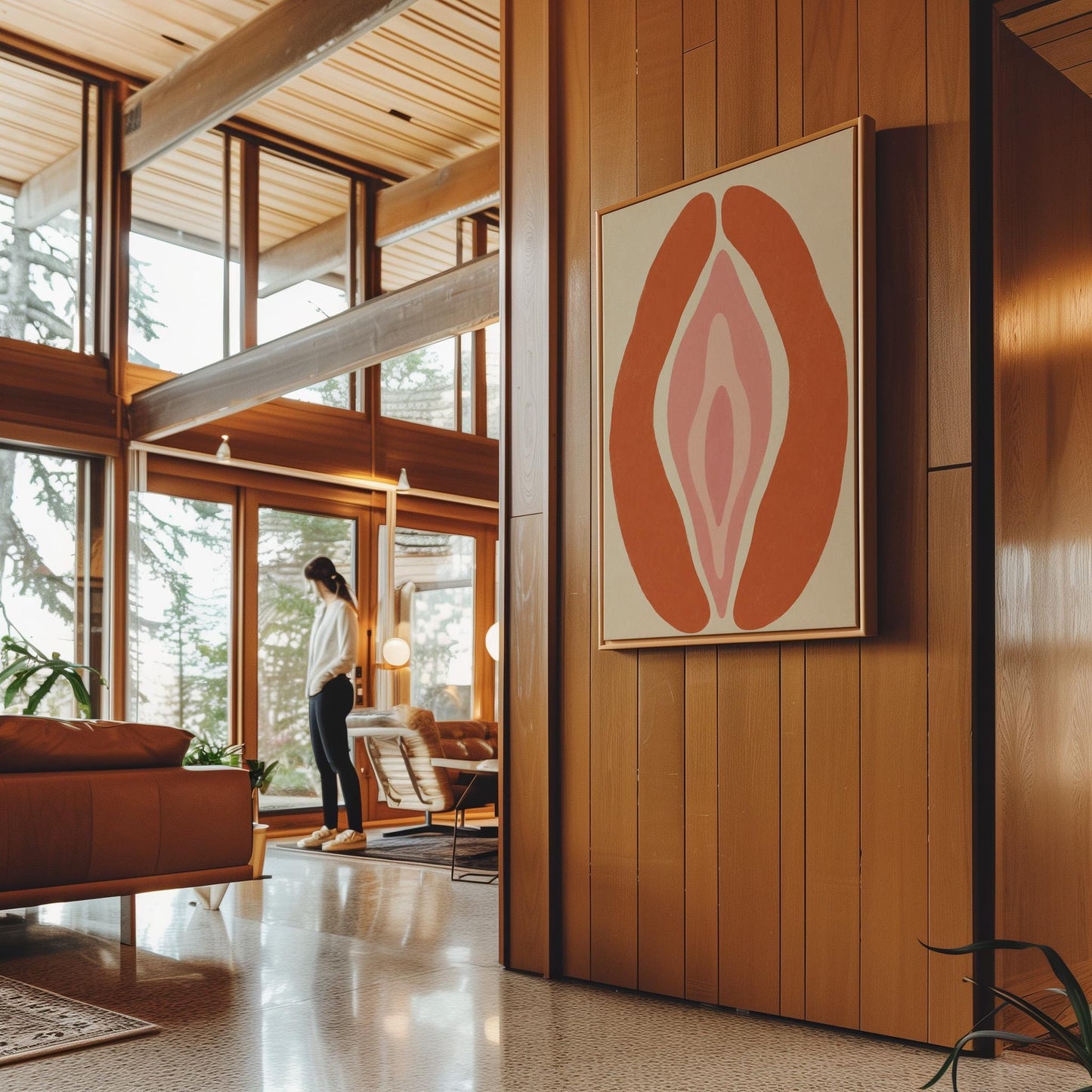 Rust orange arcs curving around a nested blush pink core on sand, canvas print styled against a soft white wall