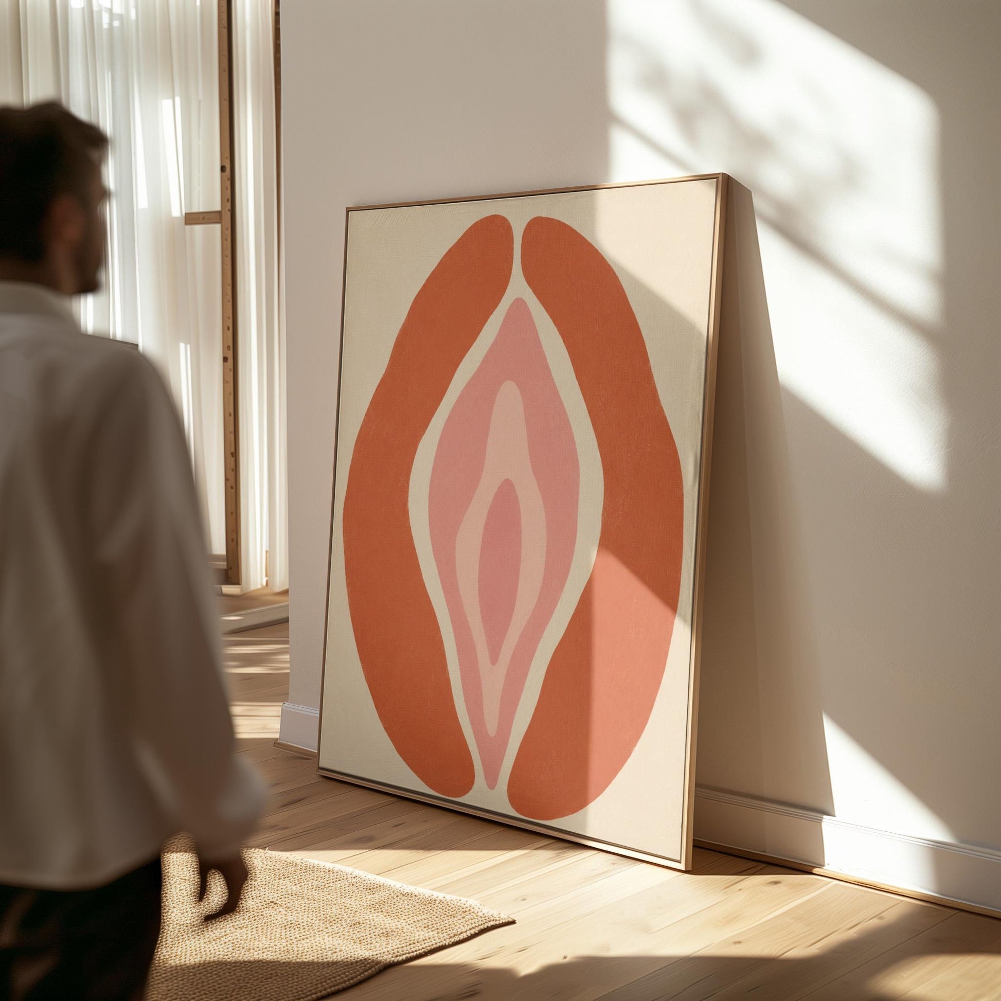 Rust orange arcs curving around a nested blush pink core on sand, canvas wall art on a quiet wall in a considered interior