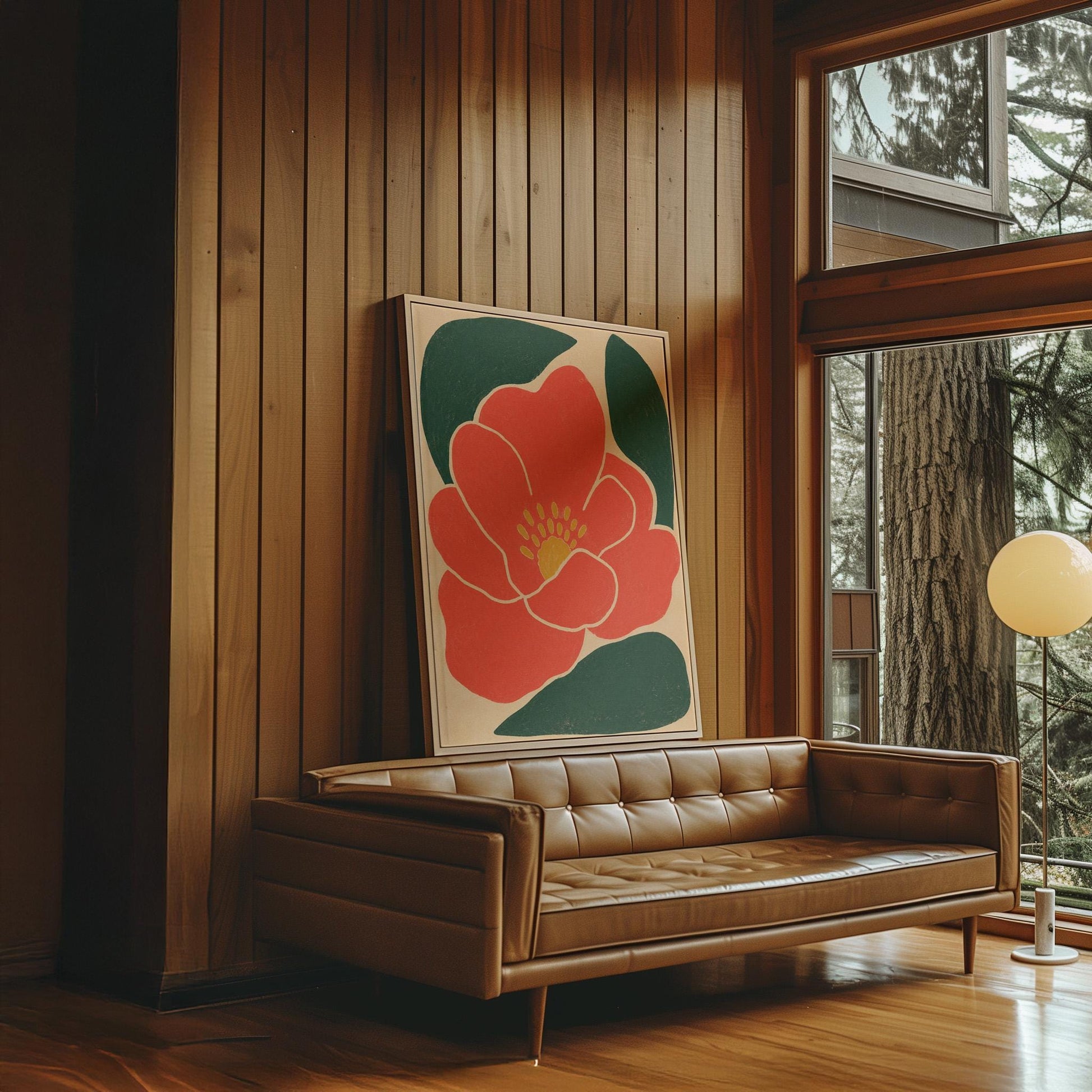 Scarlet flower with gold stamens over deep green leaves on sand, canvas print shown in a sunlit, contemporary room