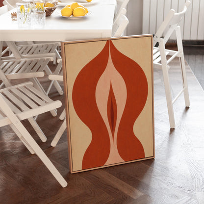 Rust red flame shaped form opening into blush and grey on sand, canvas print shown to scale in a furnished room