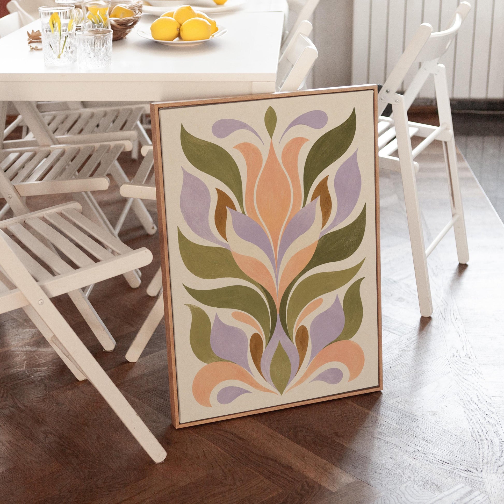 Symmetrical folk tulip motif in olive lilac and peach on cream, canvas print presented in a light, minimal room