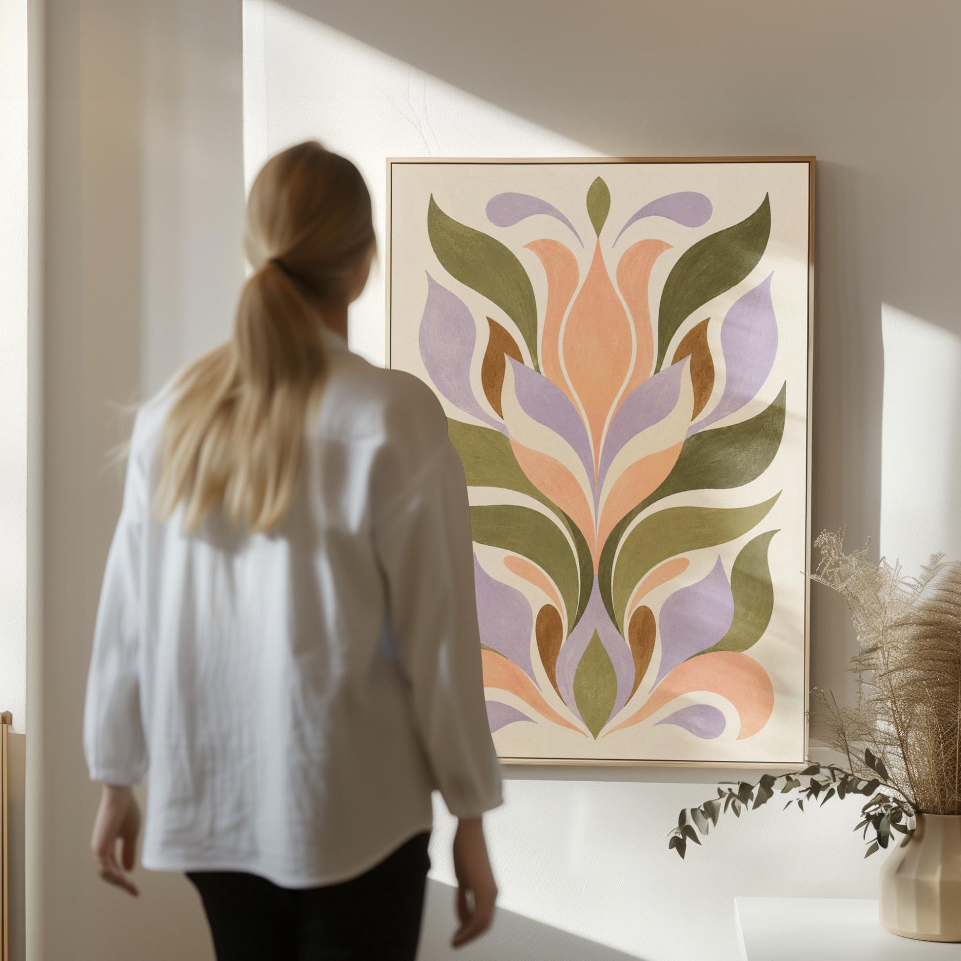 Symmetrical folk tulip motif in olive lilac and peach on cream, canvas print on a quiet wall in a considered interior
