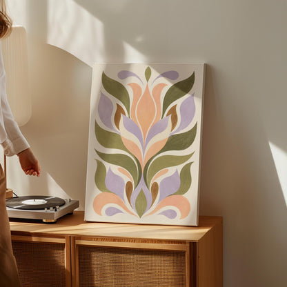 Symmetrical folk tulip motif in olive lilac and peach on cream, canvas wall art presented in a light, minimal room
