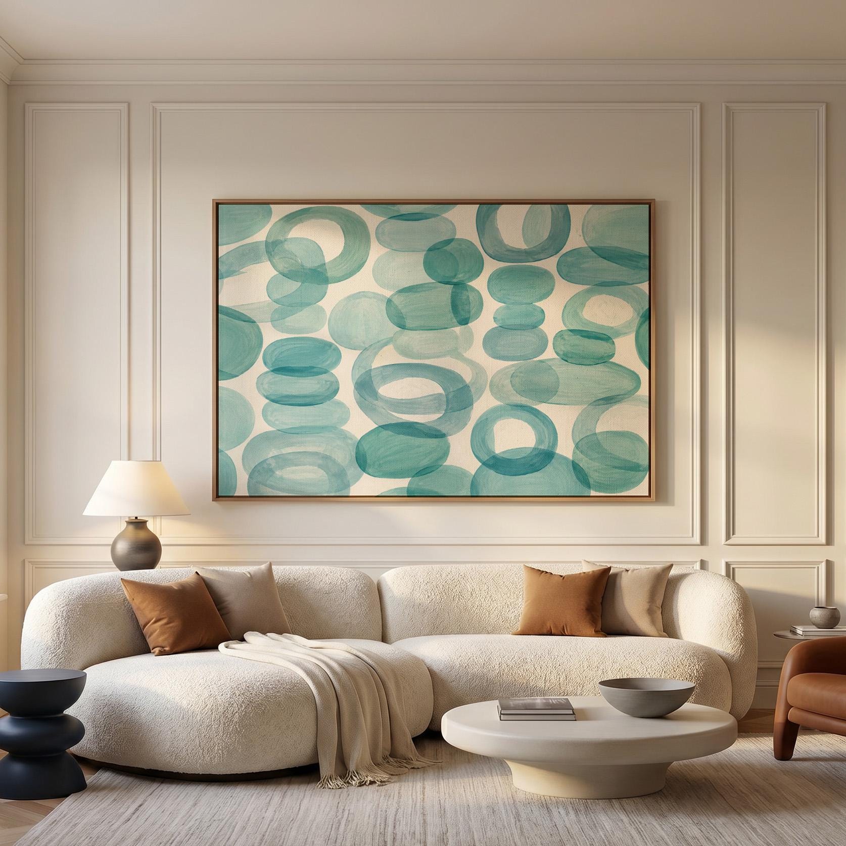 Overlapping aqua rings rolling across horizontal frame, canvas print displayed on a neutral wall in a styled interior