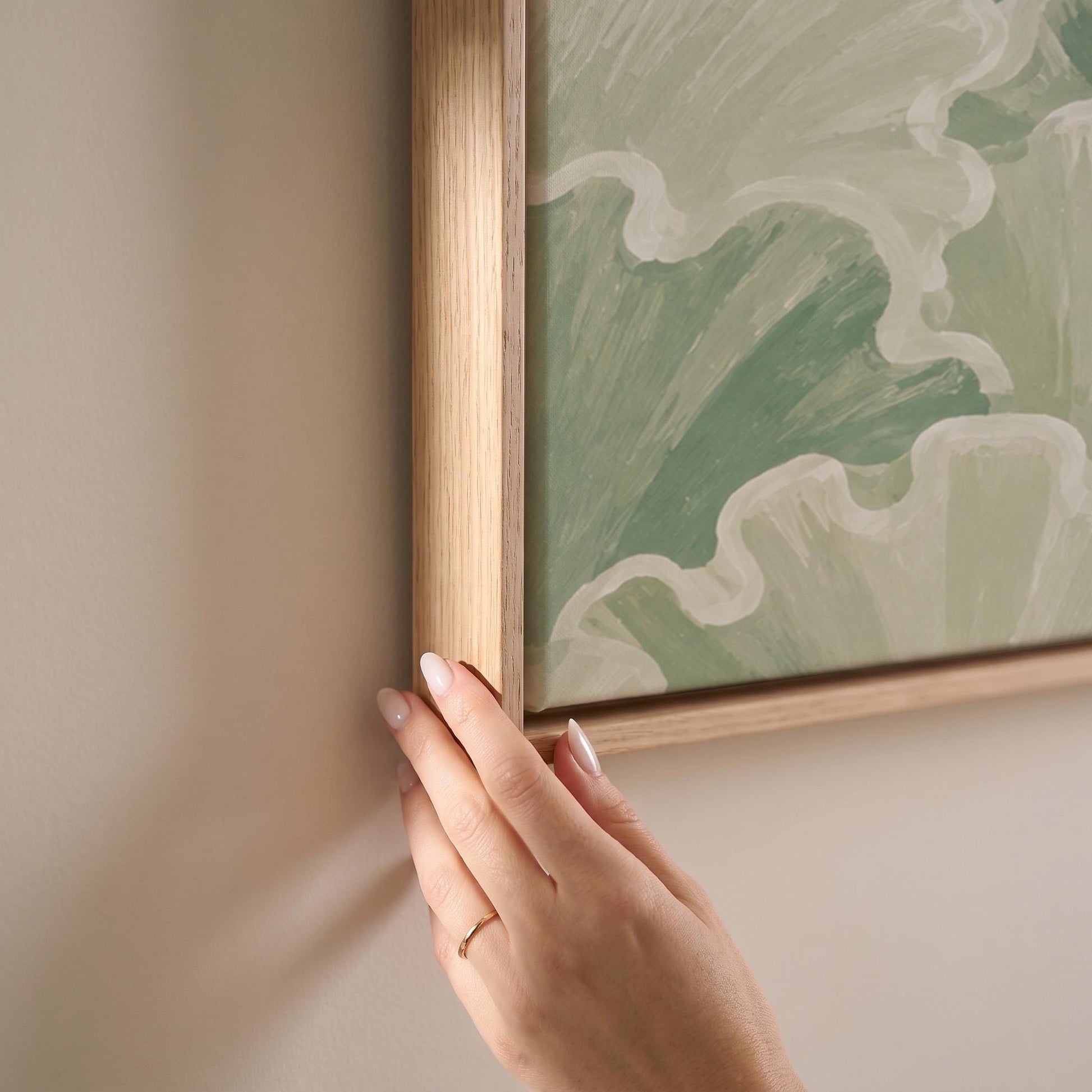 Ruffled leafy fan shapes in sage green rows, canvas print shown at full size in a light-filled bedroom