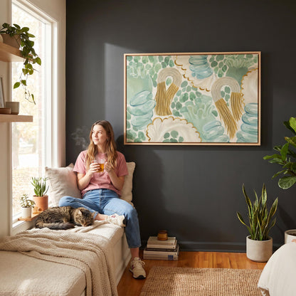 Celadon shapes with golden tassel ornaments, canvas wall art seen in a warm interior with natural light
