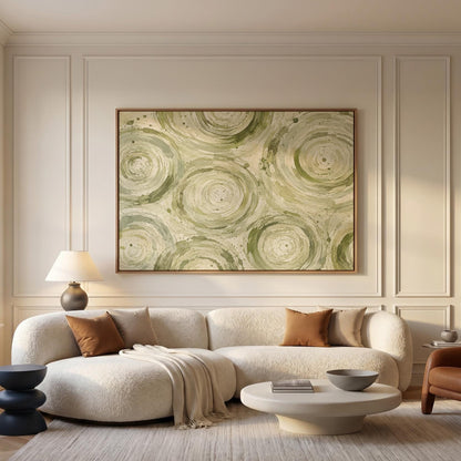 Swirling sage green ring circles, canvas print shown in a sunlit, contemporary room