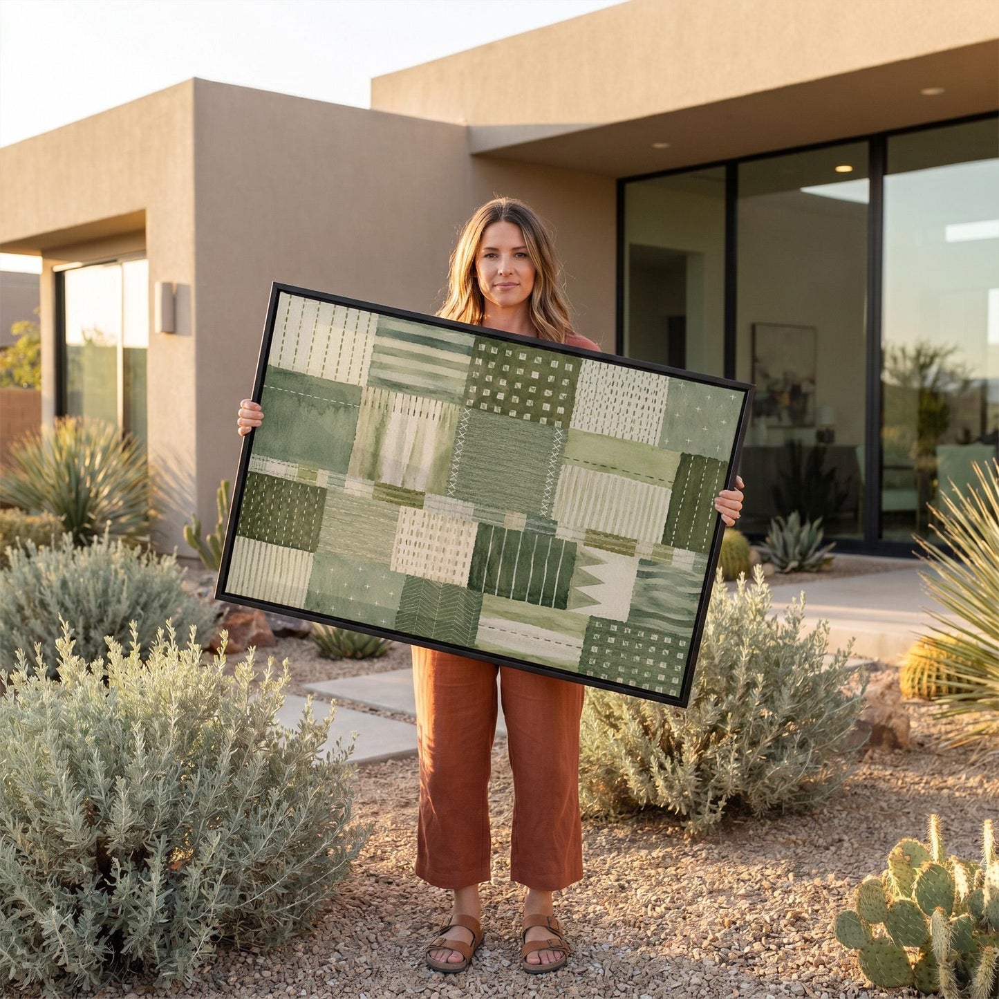 Quilted patchwork of olive green blocks, canvas print presented in a light, minimal room