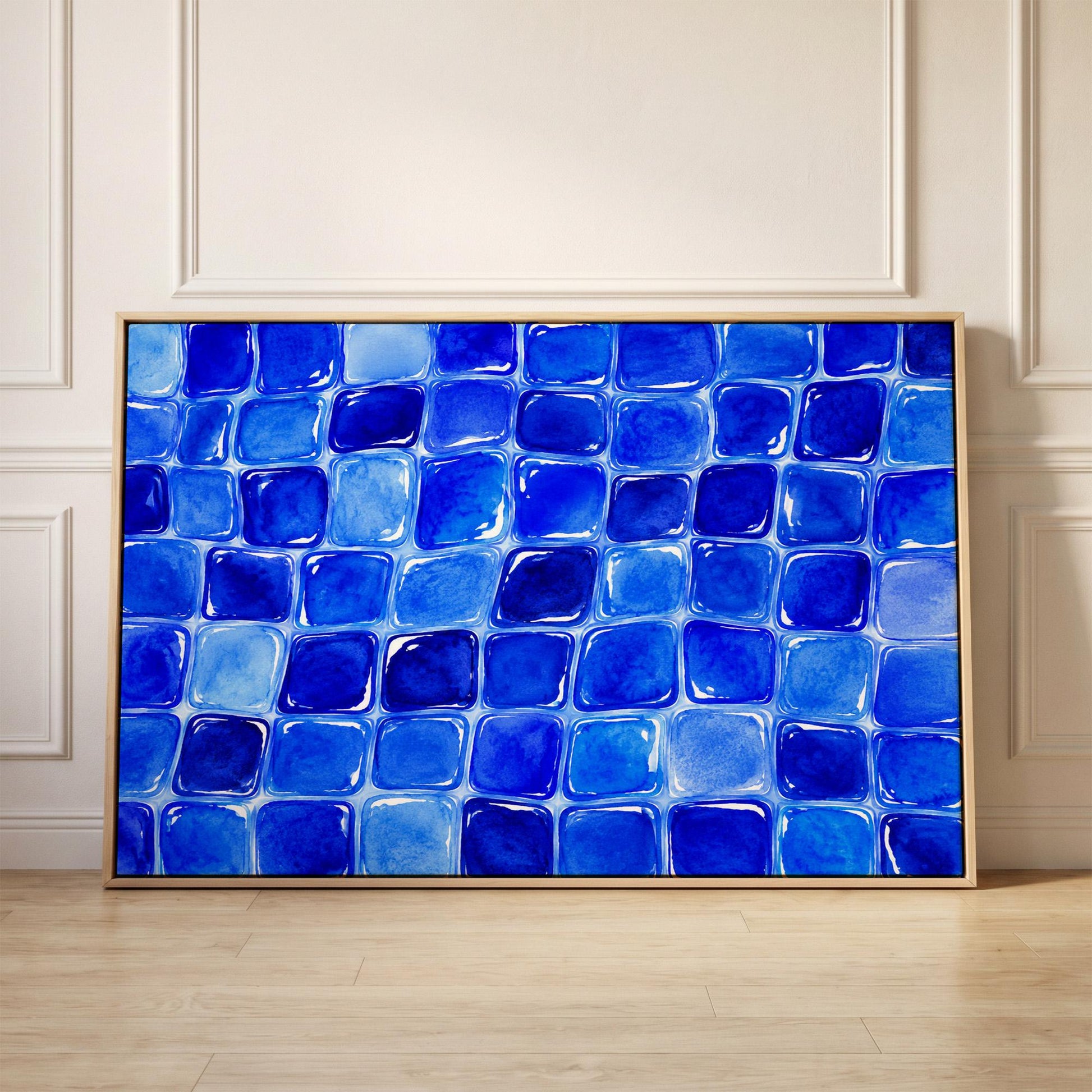 Deep sapphire mosaic tiles in wide grid, canvas print held up against a sunlit bedroom wall