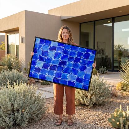 Deep sapphire mosaic tiles in wide grid, canvas print styled against a soft white wall