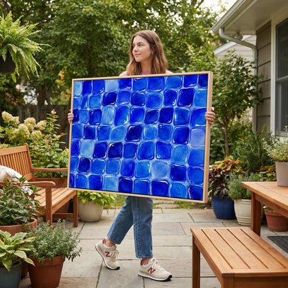 Deep sapphire mosaic tiles in wide grid, canvas print displayed on a neutral wall in a styled interior