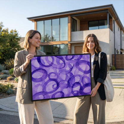 Swirling violet watercolor rings across wide frame, canvas print displayed on a neutral wall in a styled interior