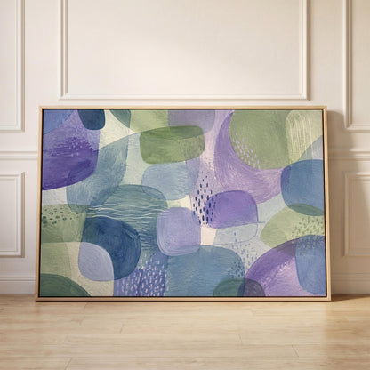 Soft muted shapes in dusty plum and sage, canvas print held up against a sunlit bedroom wall